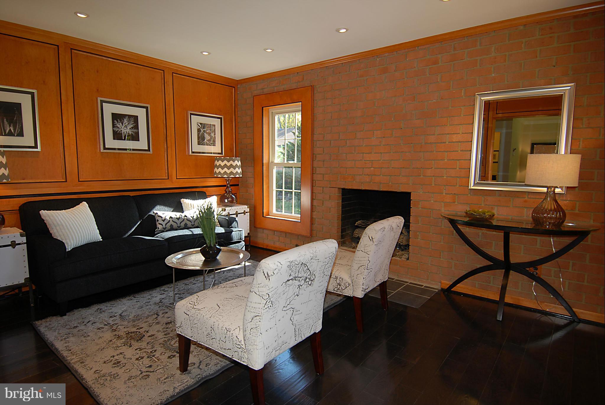 2152 Golf Course Drive Reston, VA 20191 - Photo 7 of 27 a living room with furniture and a fireplace