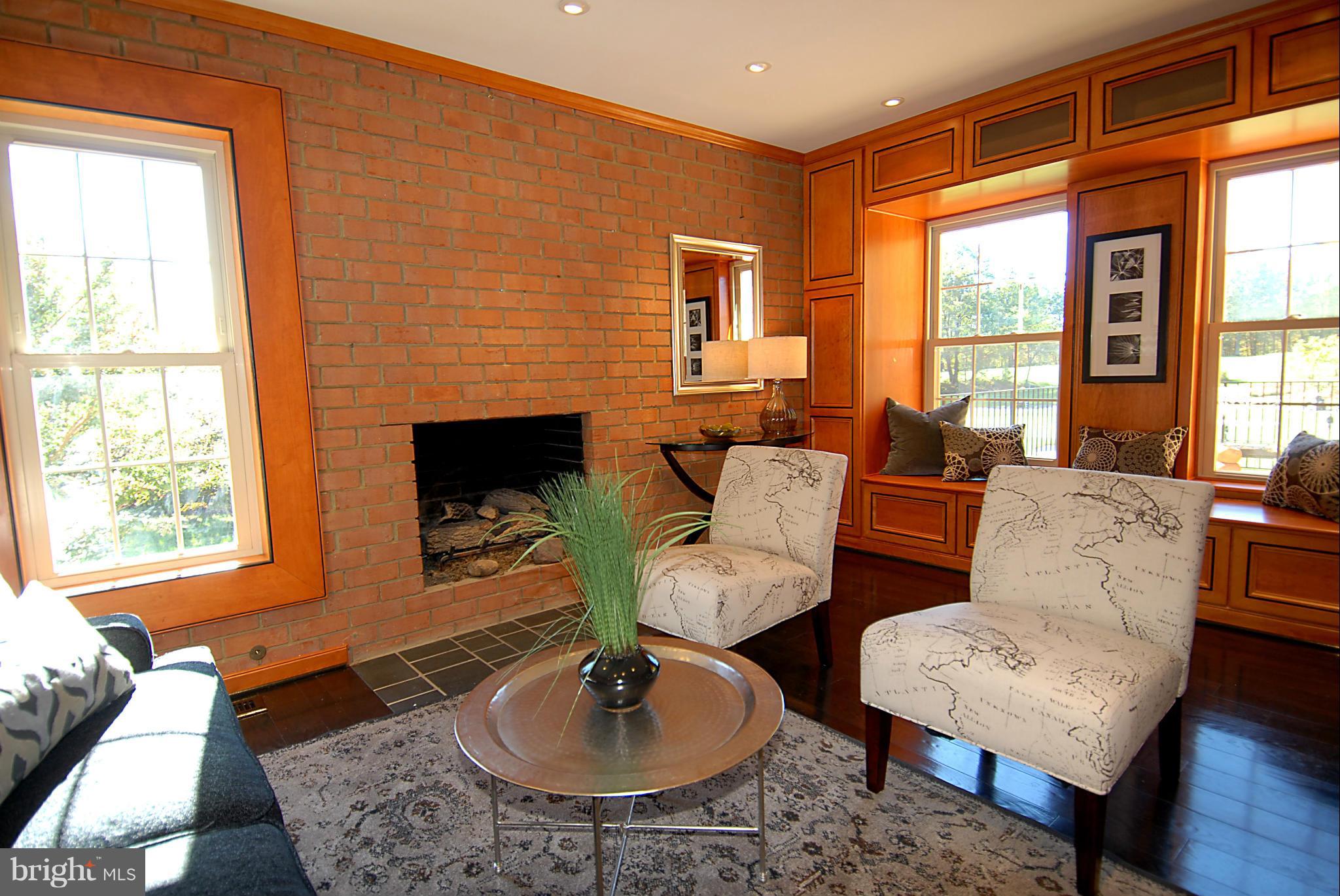 2152 Golf Course Drive Reston, VA 20191 - Photo 8 of 27 a living room with furniture and a fireplace