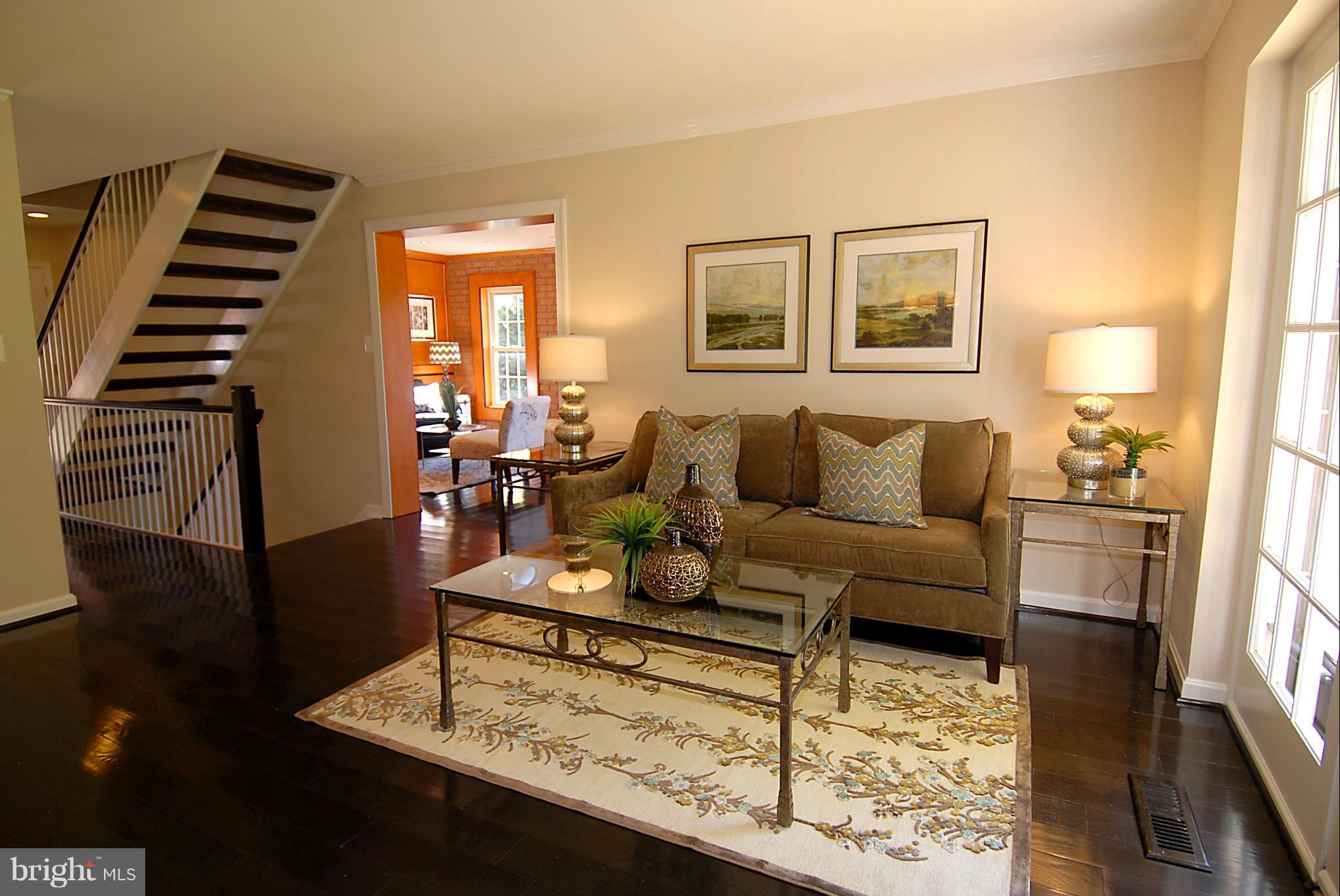 2152 Golf Course Drive Reston, VA 20191 - Photo 10 of 27 a living room with furniture and wooden floor