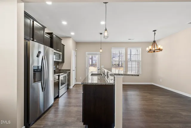 a kitchen with a stove and a microwave
