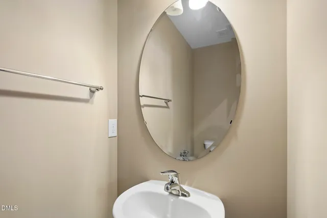 a kitchen with stainless steel appliances kitchen island a refrigerator and a wooden floor