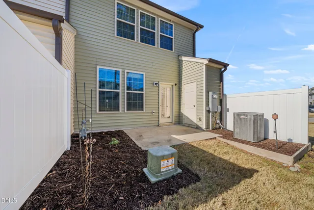 a view of a terrace with wooden fence