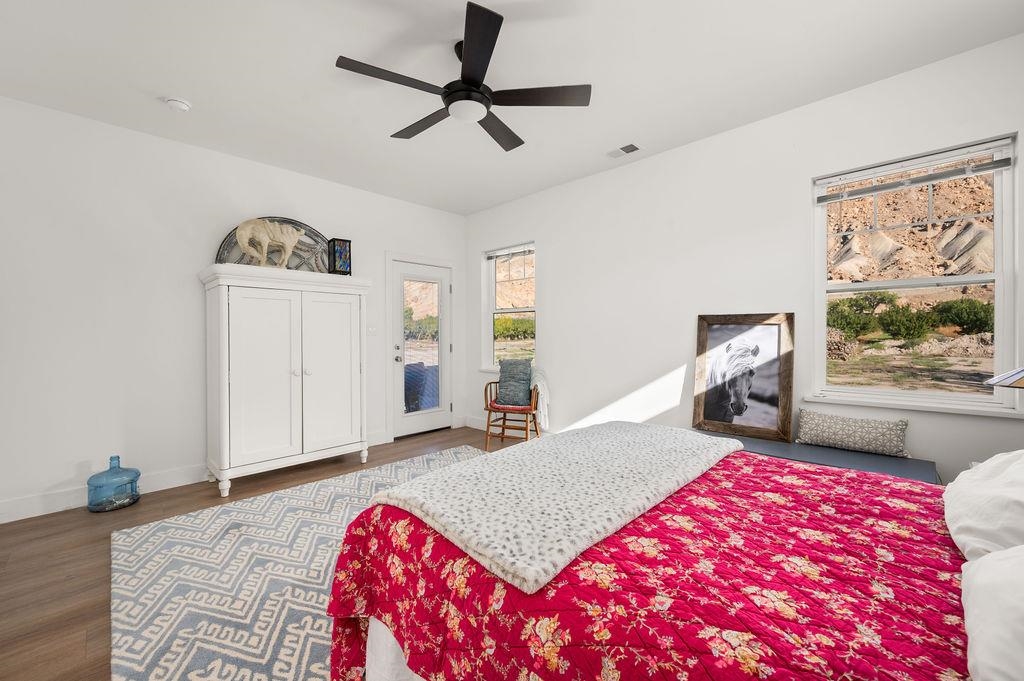 3644 G G 7/10 Road Palisade, CO 81526 - Photo 14 of 42 a bedroom with a bed and a painting on the wall