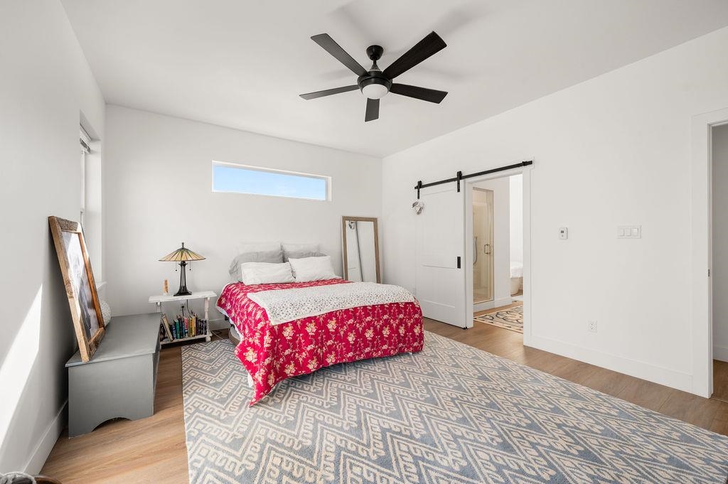 3644 G G 7/10 Road Palisade, CO 81526 - Photo 15 of 42 a bedroom with a bed and a couch