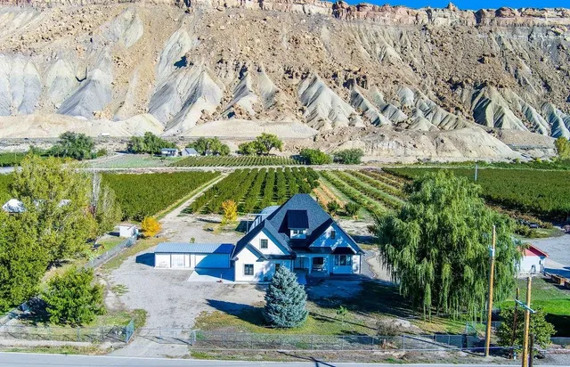 a view of a wooden deck with a yard