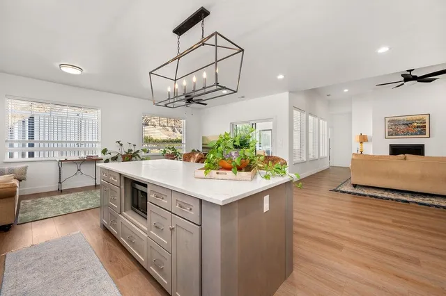 a kitchen with stainless steel appliances granite countertop a sink and dishwasher