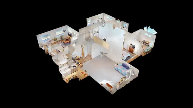 a bed sitting in a bedroom next to a lamp