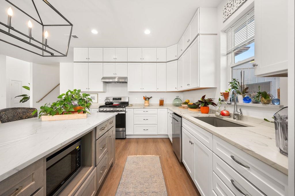 3644 G G 7/10 Road Palisade, CO 81526 - Photo 6 of 42 a kitchen with kitchen island granite countertop lots of counter top space and cabinets