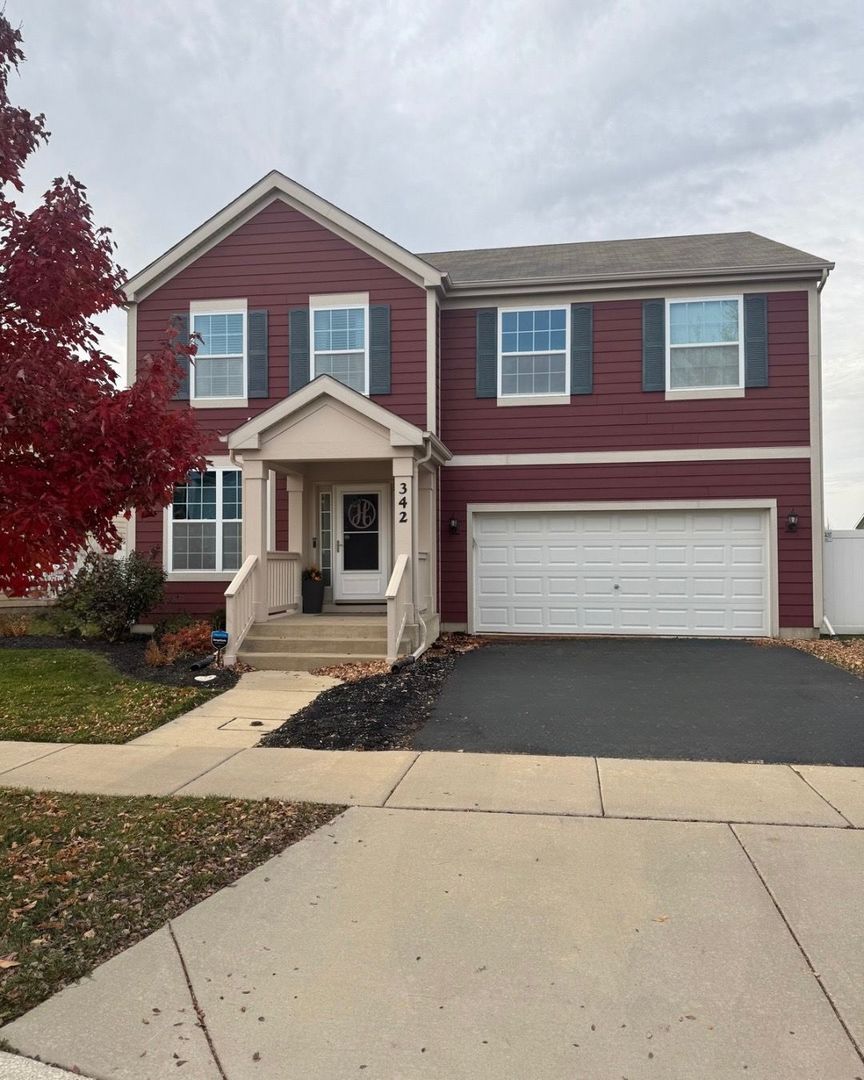 342 Snowdrop Lane Elgin, IL 60124 - Photo 1 of 28 a front view of a house with a yard