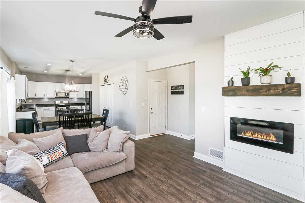 342 Snowdrop Lane Elgin, IL 60124 - Photo 14 of 28 a living room with furniture and a fireplace
