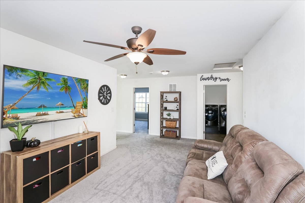 342 Snowdrop Lane Elgin, IL 60124 - Photo 17 of 28 a view of a livingroom with furniture and a flat screen tv
