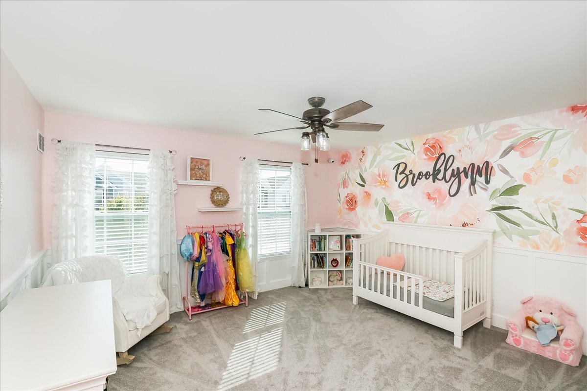 342 Snowdrop Lane Elgin, IL 60124 - Photo 21 of 28 a bedroom with furniture and a chandelier