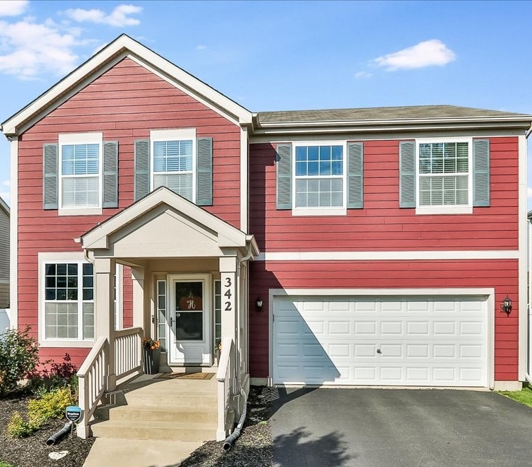 342 Snowdrop Lane Elgin, IL 60124 - Photo 28 of 28 a front view of a house with a yard and garage
