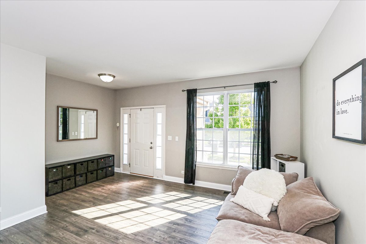 342 Snowdrop Lane Elgin, IL 60124 - Photo 6 of 28 a living room with furniture and a window