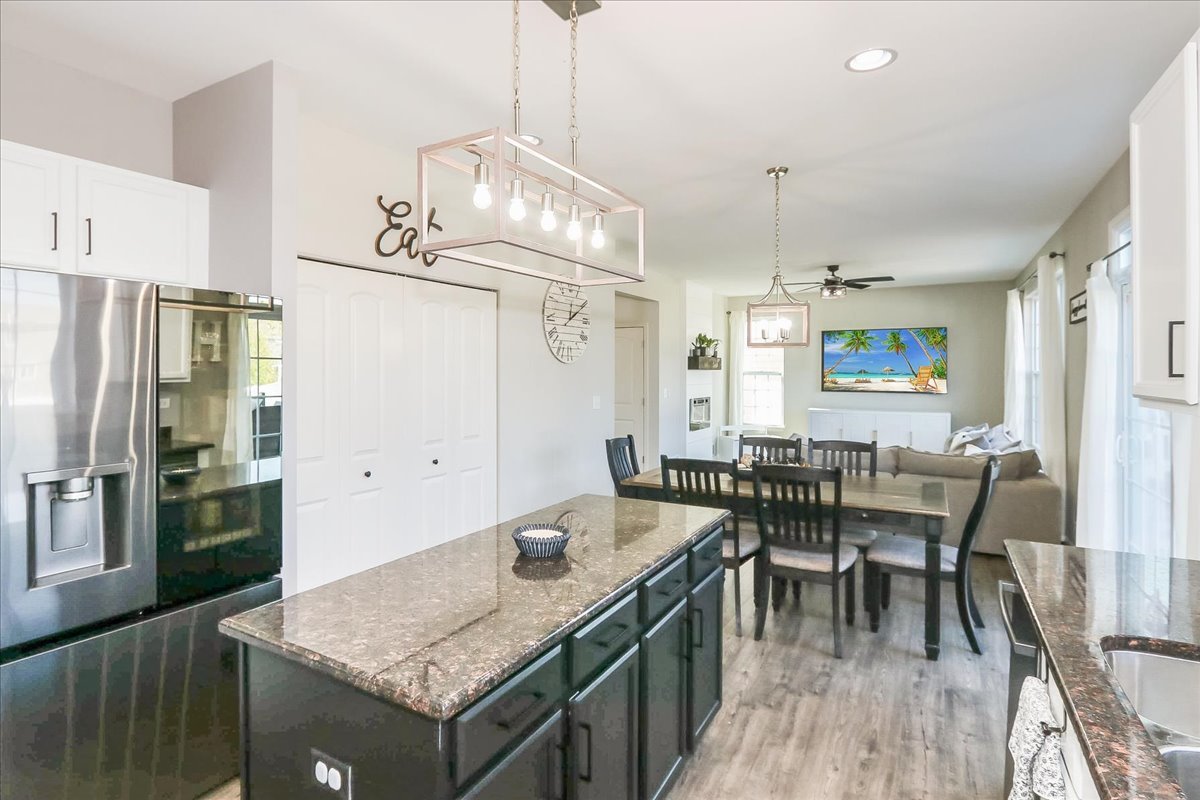 342 Snowdrop Lane Elgin, IL 60124 - Photo 10 of 28 a kitchen with a table chairs and refrigerator