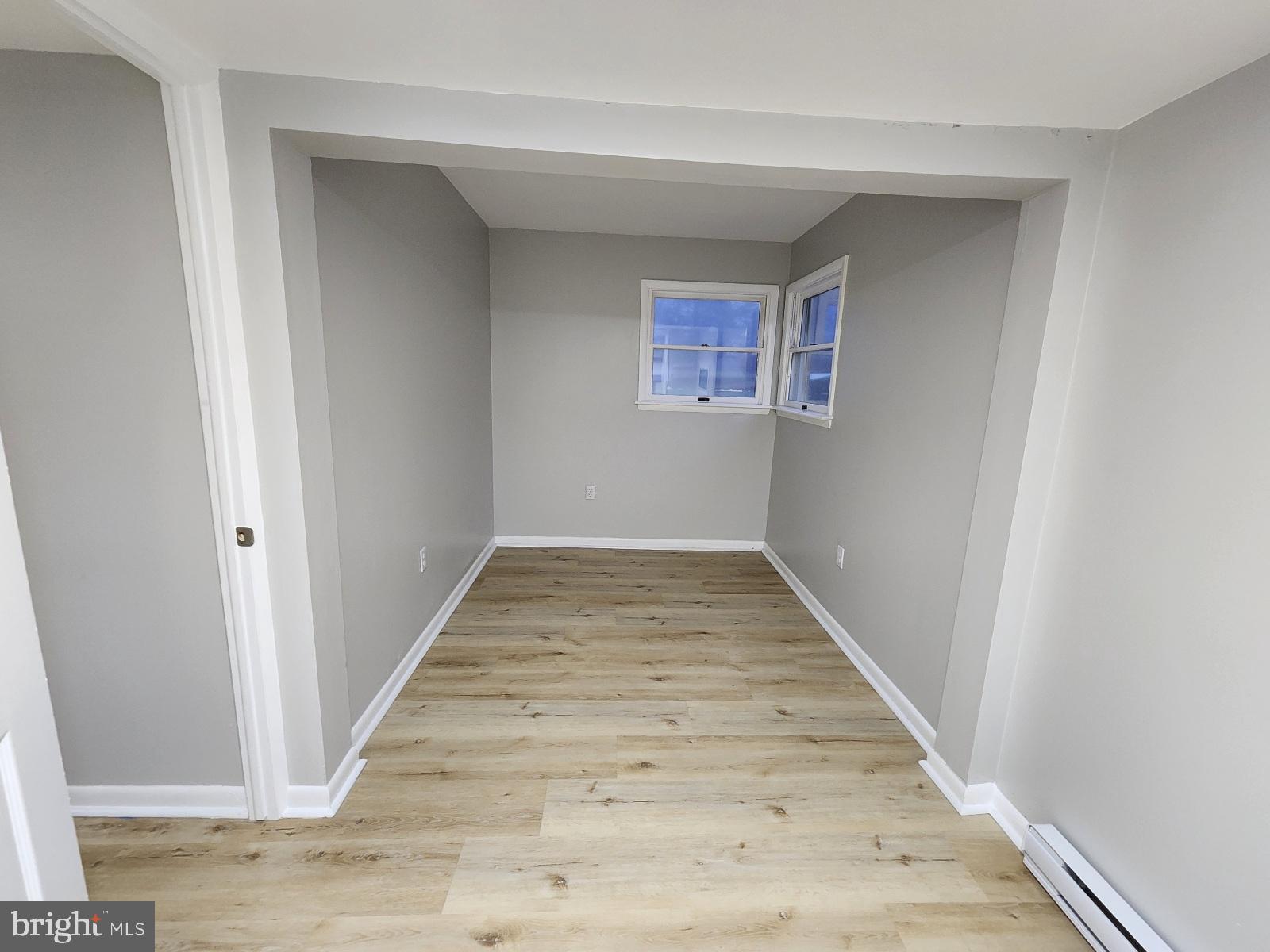 20307 Pond Circle Road Midlothian, MD 21543 - Photo 19 of 29 a view of a hallway with wooden floor