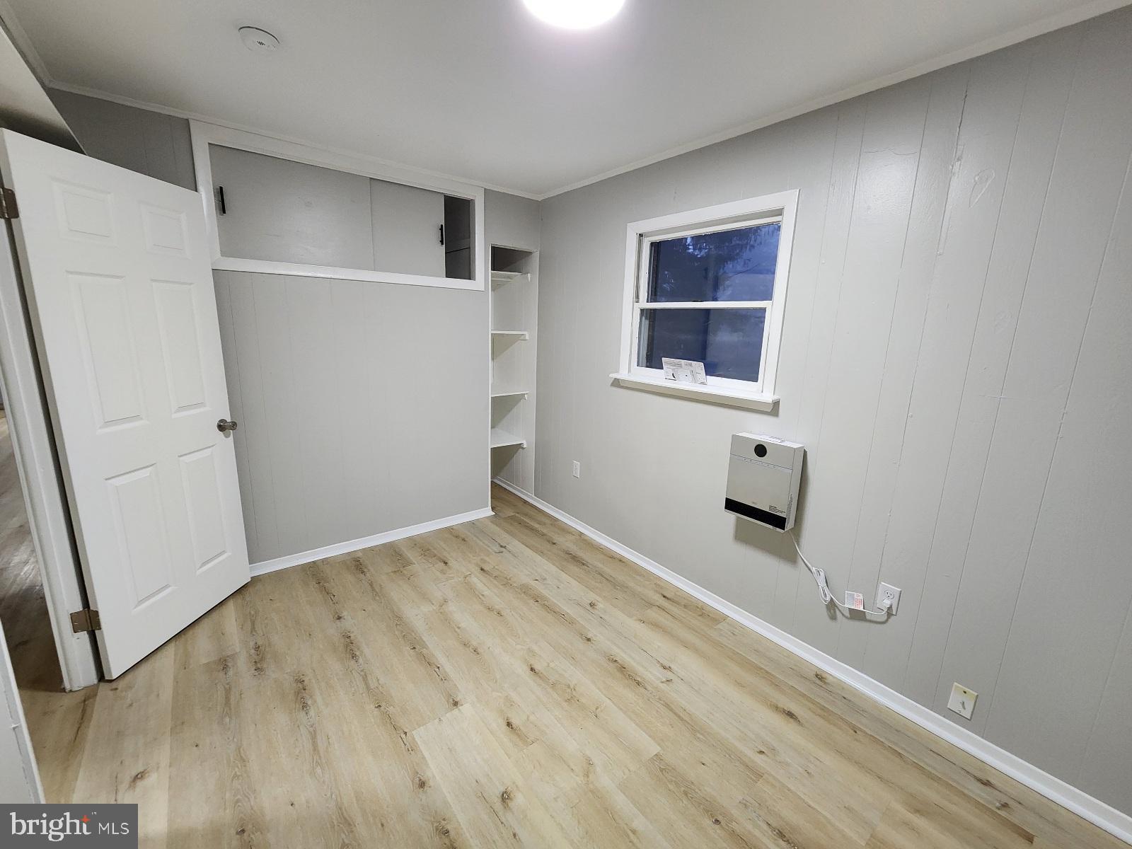 20307 Pond Circle Road Midlothian, MD 21543 - Photo 21 of 29 a view of a room with a wooden floor and a window