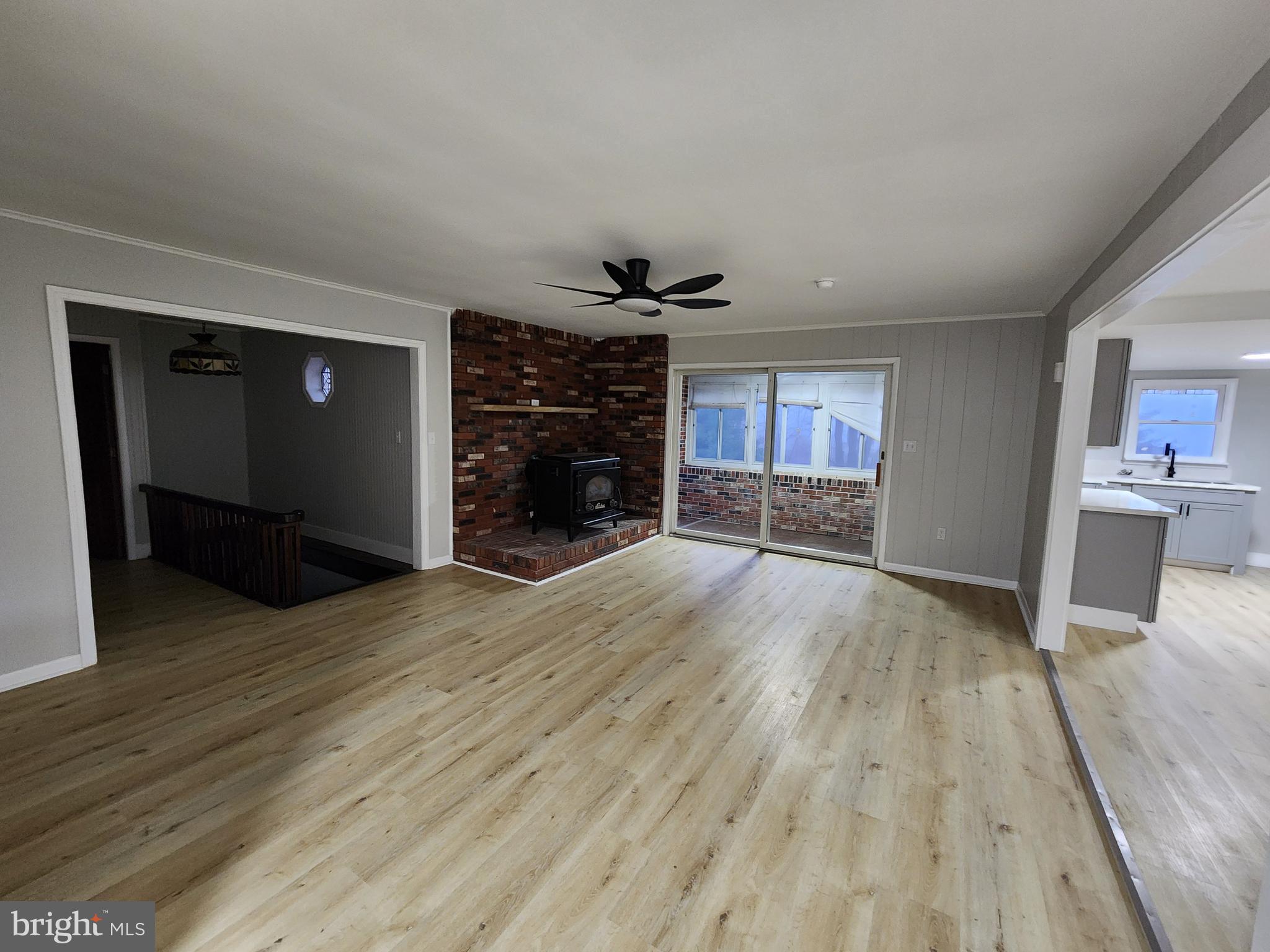 20307 Pond Circle Road Midlothian, MD 21543 - Photo 23 of 29 wooden floor in an empty room with a fireplace