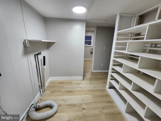 wooden floor in an empty room with a fireplace