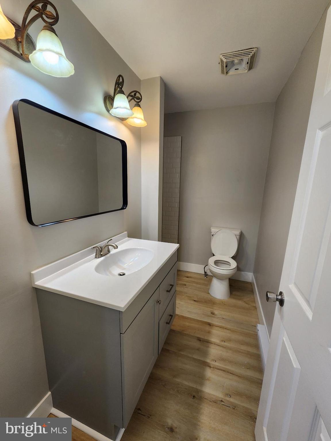 20307 Pond Circle Road Midlothian, MD 21543 - Photo 25 of 29 a bathroom with a sink toilet and mirror