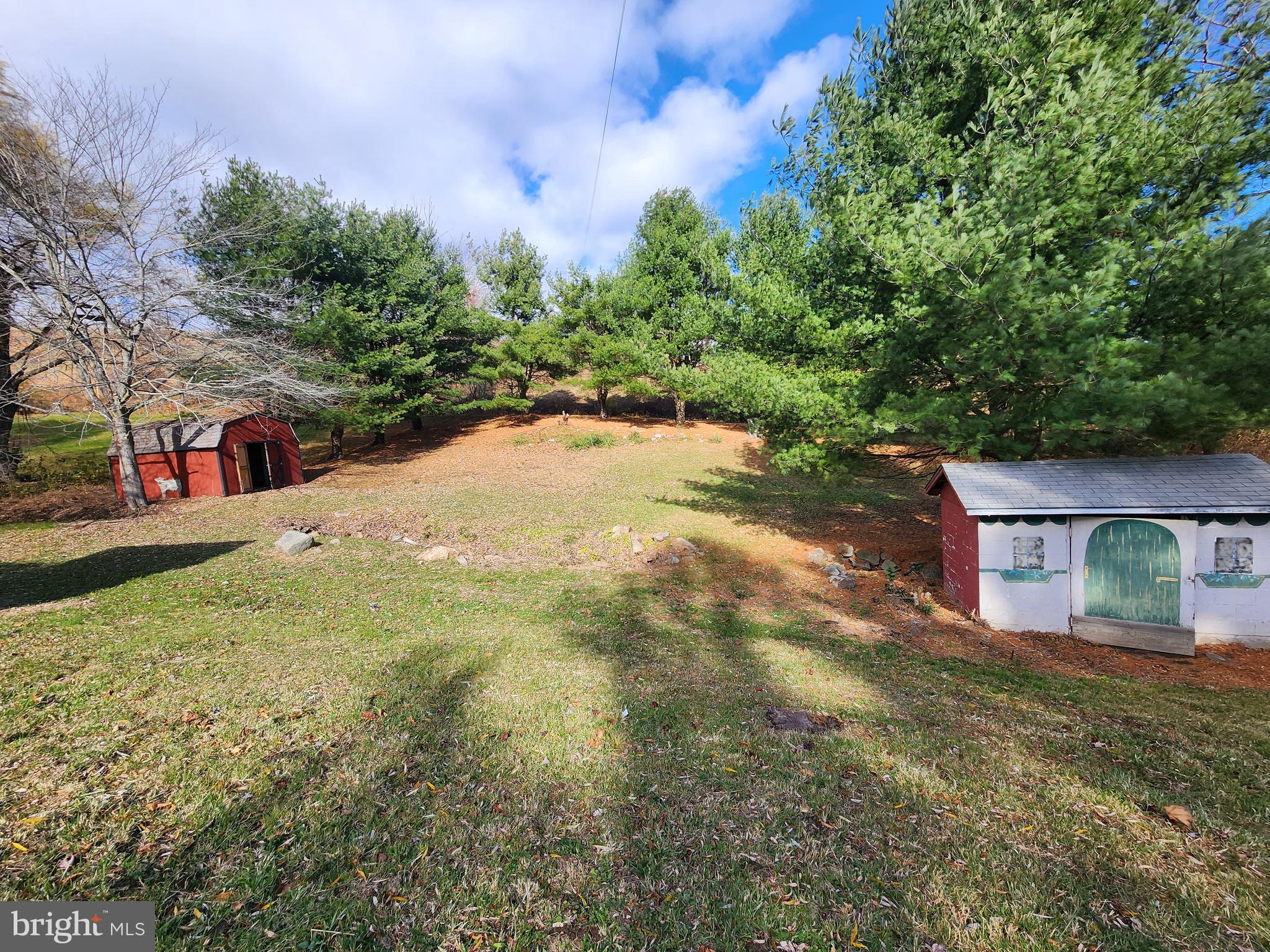 20307 Pond Circle Road Midlothian, MD 21543 - Photo 5 of 29 a view of street with small yard and large trees