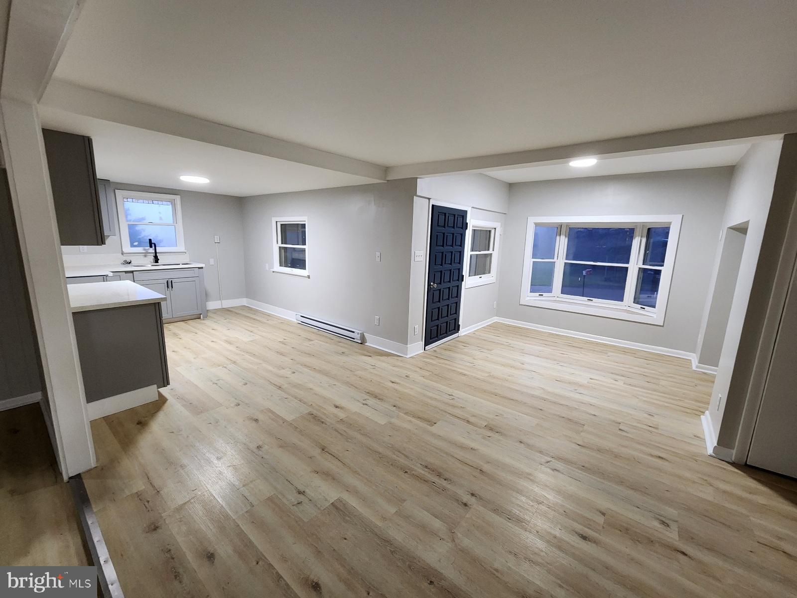 20307 Pond Circle Road Midlothian, MD 21543 - Photo 29 of 29 an empty room with wooden floor and windows