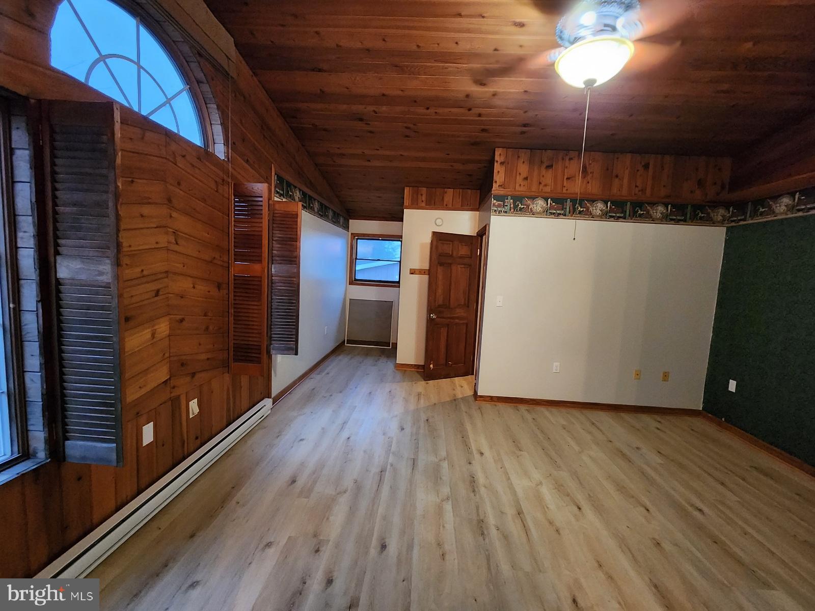 20307 Pond Circle Road Midlothian, MD 21543 - Photo 7 of 29 a view of a room with wooden floor