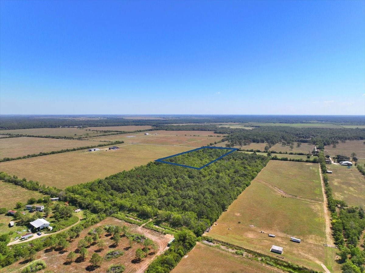 6246 Eagle Road Anahuac, TX 77514 - Photo 6 of 6 a view of a lake with a beach