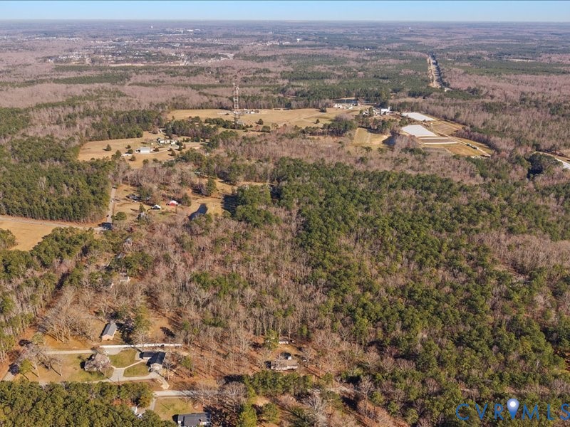 21009 Skinquarter Road Moseley, VA 23120 - Photo 9 of 10 an aerial view of residential houses with outdoor space