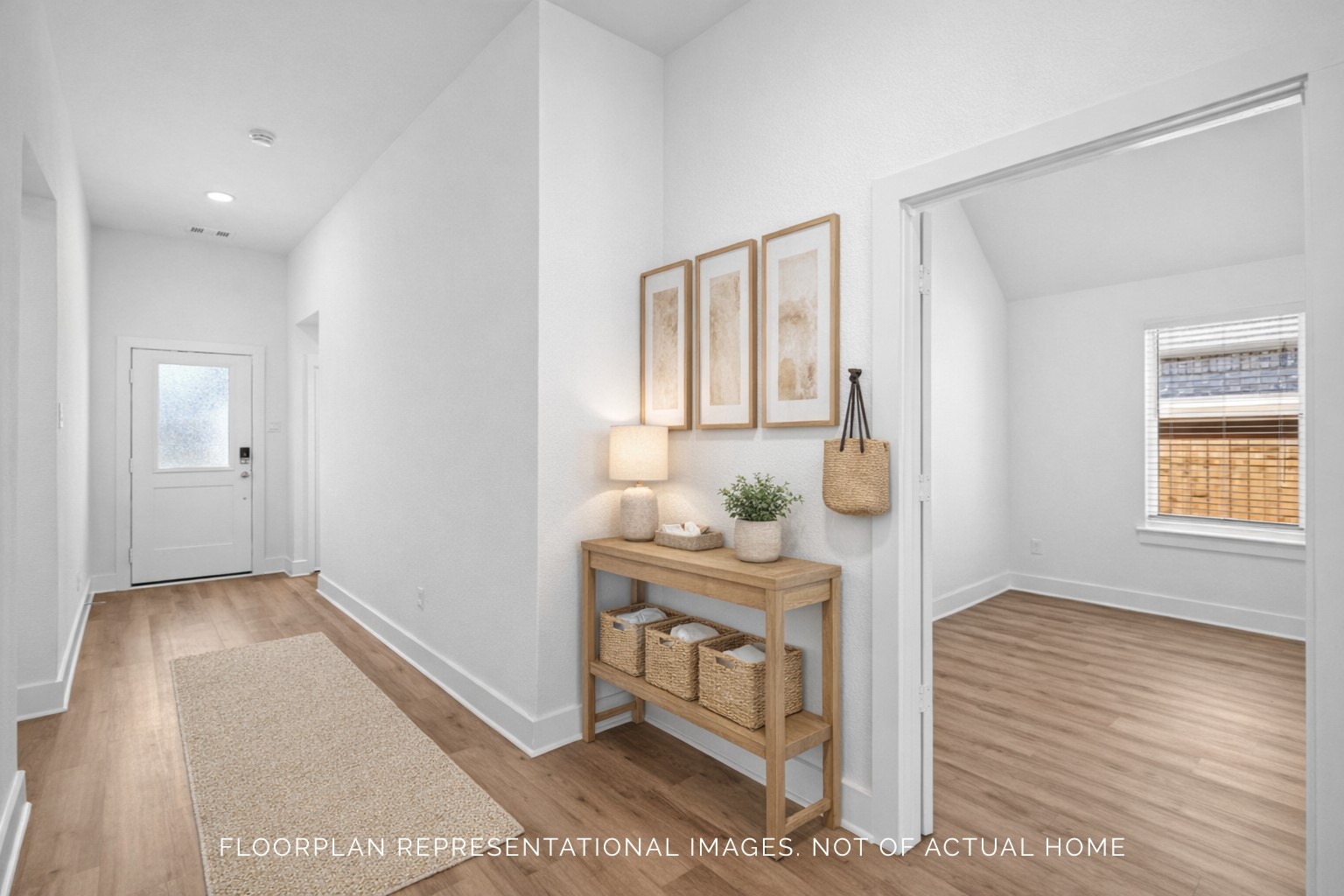 2123 Lone Bronco Boulevard Rosenberg, TX 77471 - Photo 13 of 16 a hallway with furniture and wooden floor