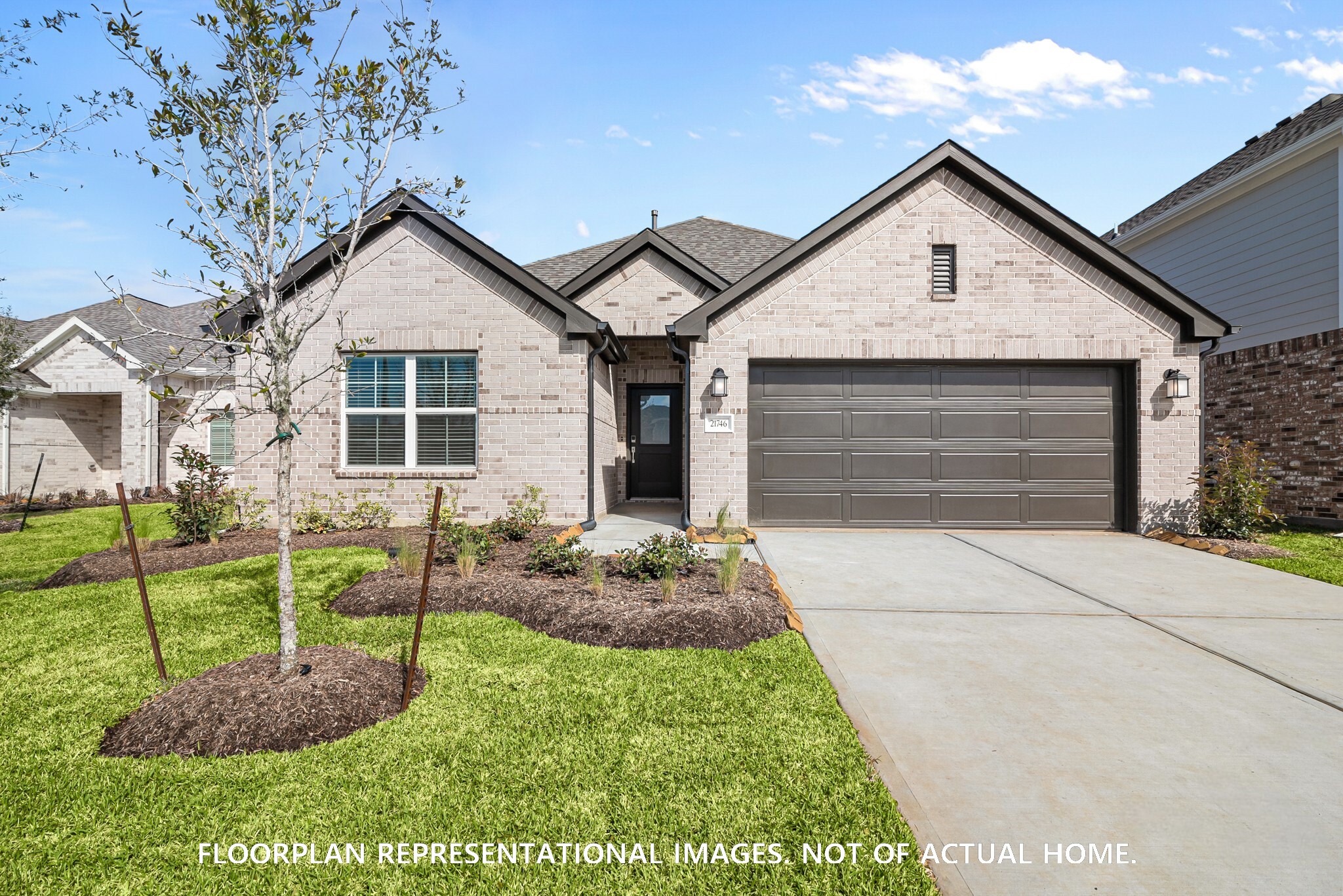 2123 Lone Bronco Boulevard Rosenberg, TX 77471 - Photo 4 of 16 a front view of a house with garden