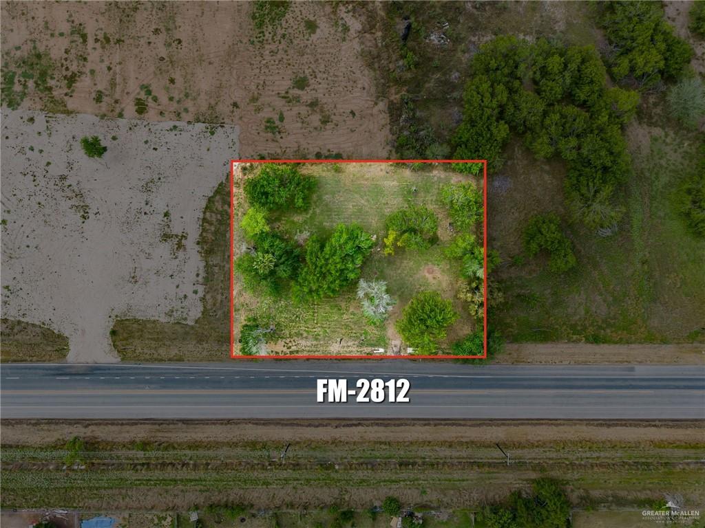 0 Fm 2812 Edcouch, TX 78538 - Photo 2 of 7 a view of a bench sitting in middle of a yard