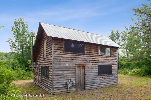 a aerial view of a house with a yard