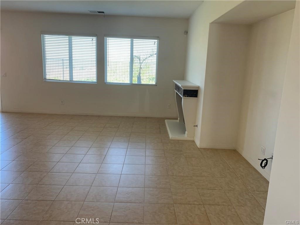 16965 Spring Canyon Place Riverside, CA 92503 - Photo 7 of 8 a view of an empty room with a window