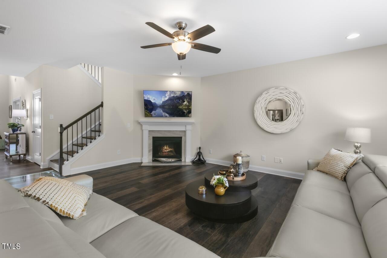 3356 Table Mountain Pine Drive Raleigh, NC 27616 - Photo 11 of 41 a living room with furniture and a fireplace