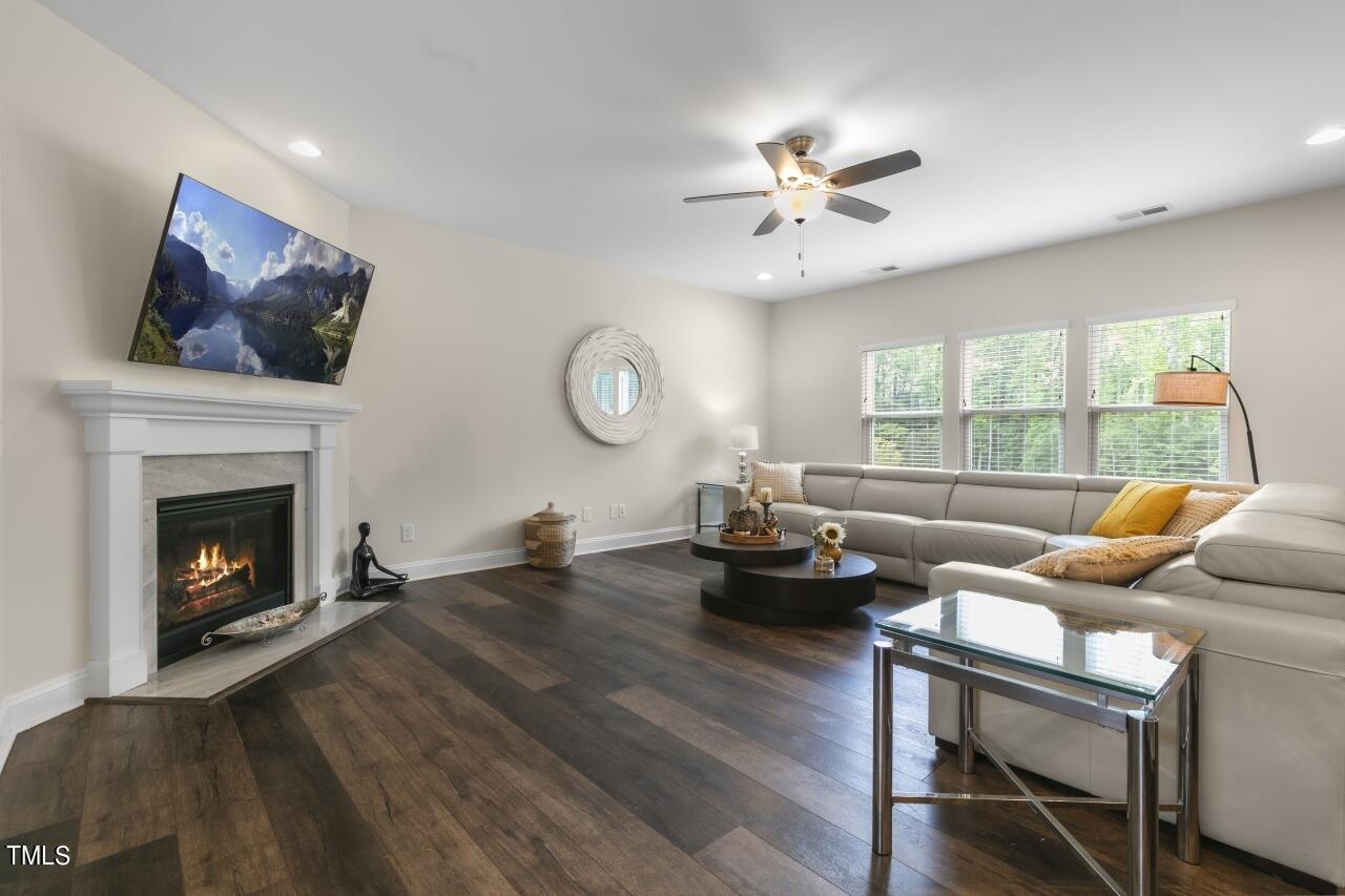 3356 Table Mountain Pine Drive Raleigh, NC 27616 - Photo 12 of 41 a living room with furniture and a fireplace