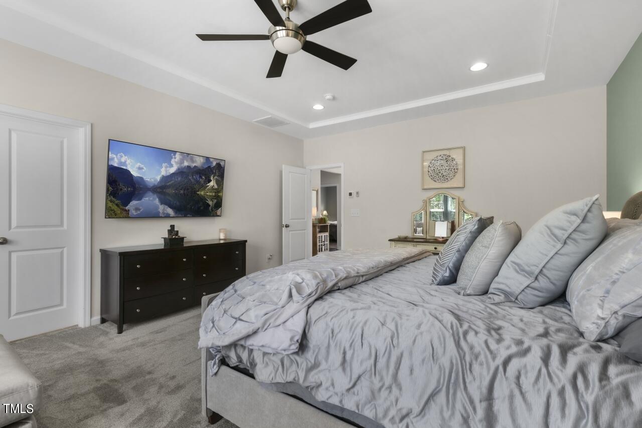 3356 Table Mountain Pine Drive Raleigh, NC 27616 - Photo 15 of 41 a bedroom with a bed and a flat screen tv