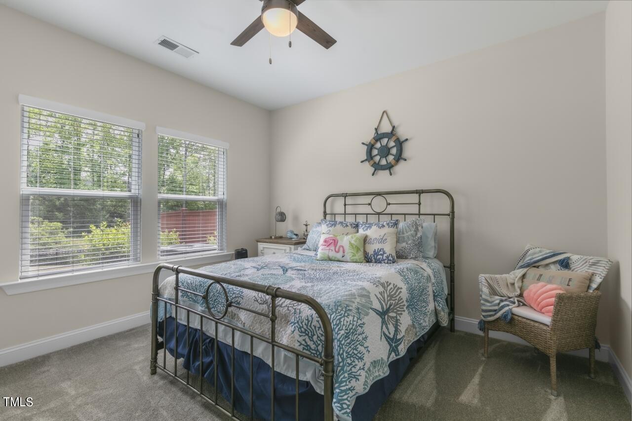 3356 Table Mountain Pine Drive Raleigh, NC 27616 - Photo 17 of 41 a bedroom with a bed and a window