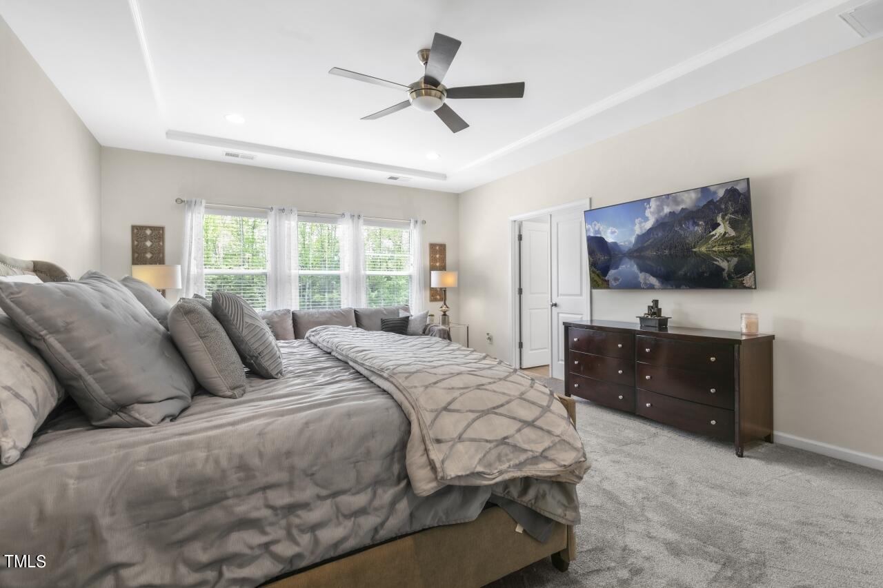 3356 Table Mountain Pine Drive Raleigh, NC 27616 - Photo 20 of 41 a bedroom with a bed and a flat screen tv