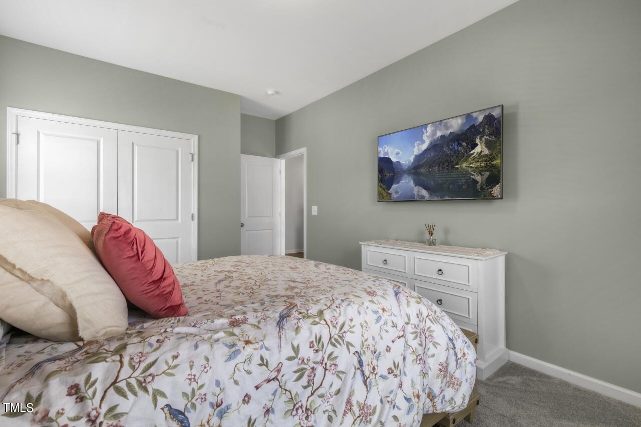 3356 Table Mountain Pine Drive Raleigh, NC 27616 - Photo 27 of 41 a bedroom with a bed and a lamp