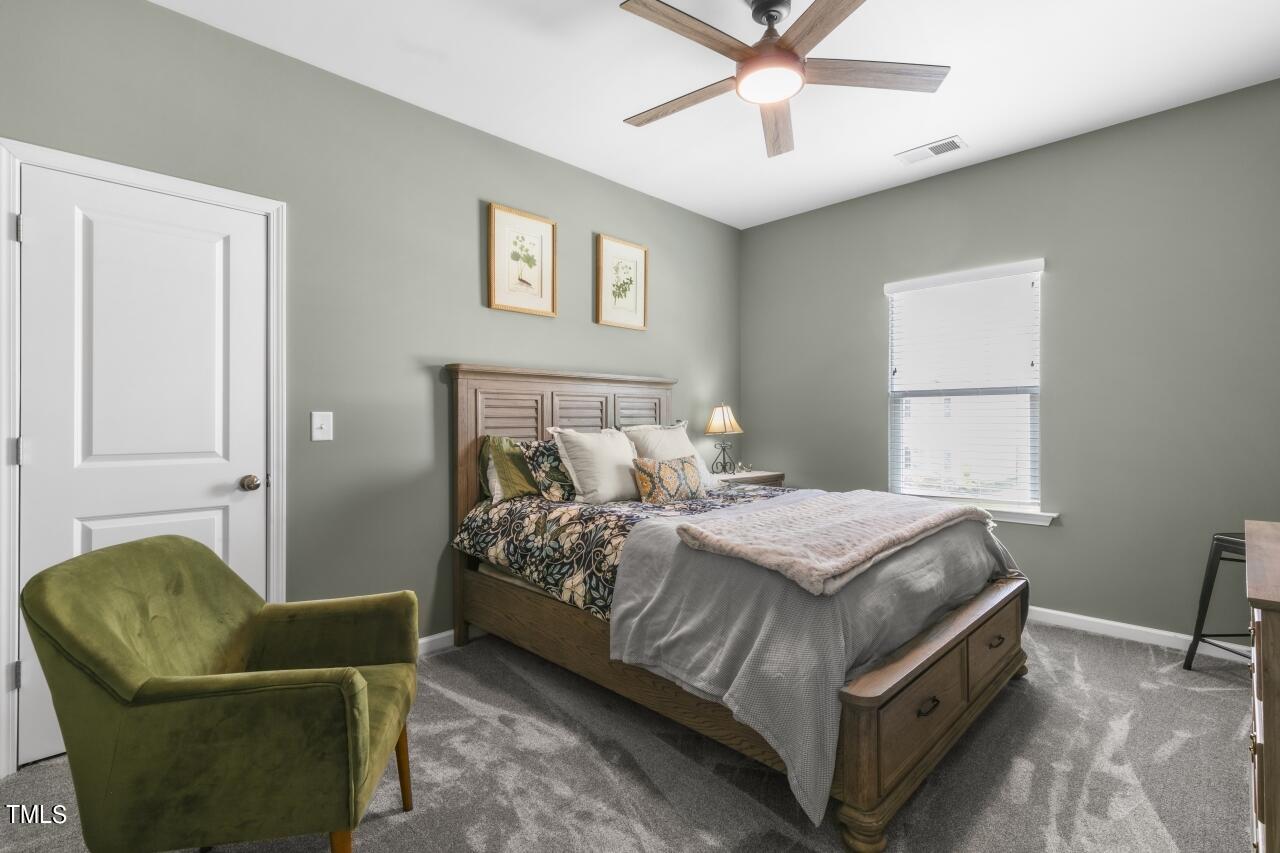 3356 Table Mountain Pine Drive Raleigh, NC 27616 - Photo 28 of 41 a bedroom with a bed and a couch