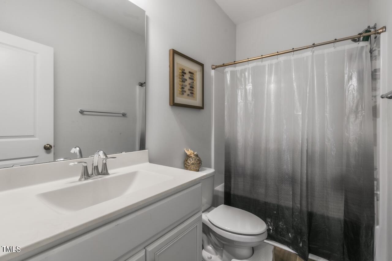3356 Table Mountain Pine Drive Raleigh, NC 27616 - Photo 30 of 41 a bathroom with a sink a toilet and shower