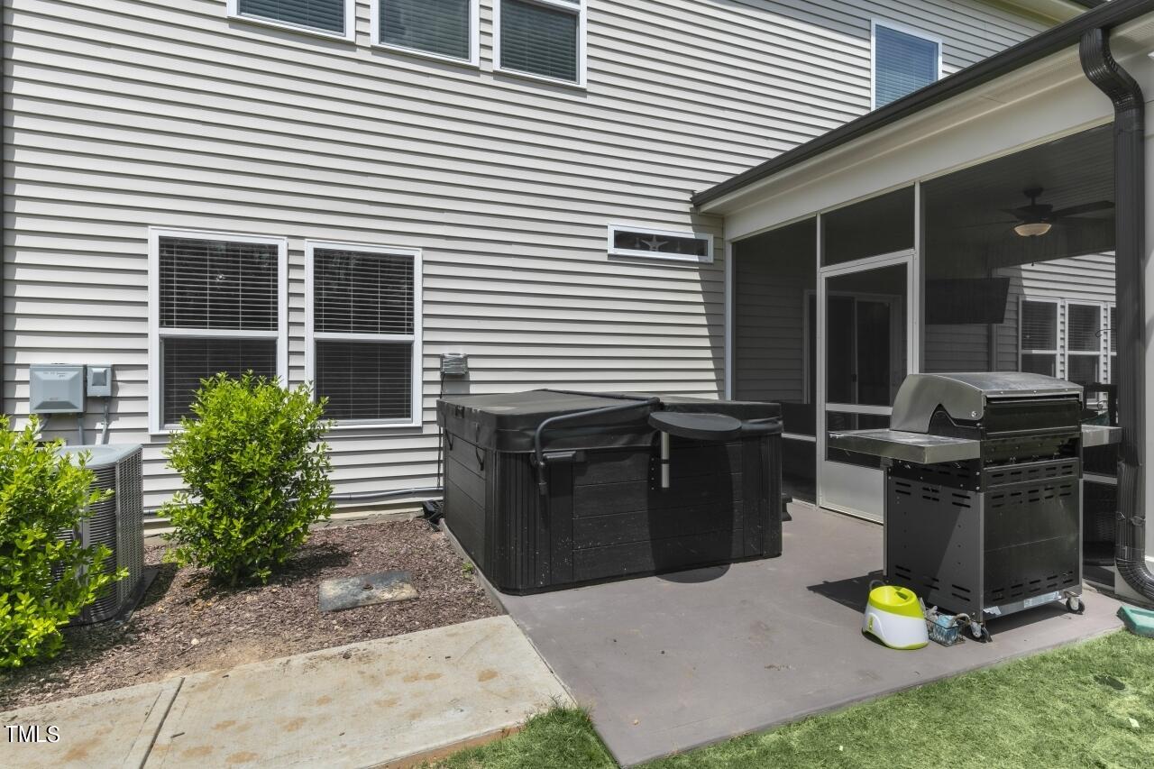 3356 Table Mountain Pine Drive Raleigh, NC 27616 - Photo 38 of 41 a view of a patio with chairs and potted plants