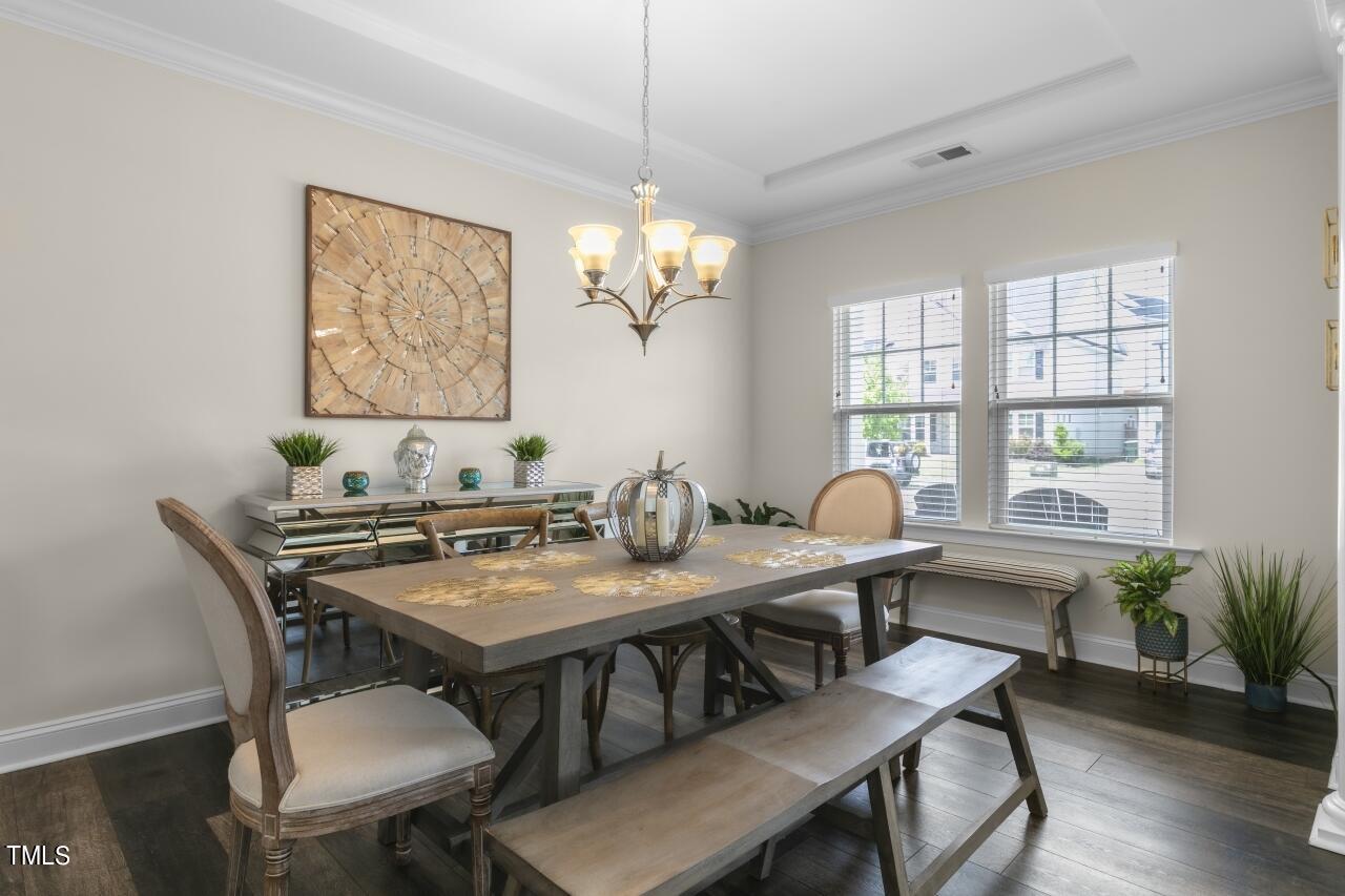 3356 Table Mountain Pine Drive Raleigh, NC 27616 - Photo 5 of 41 a view of a dining room with furniture window and wooden floor