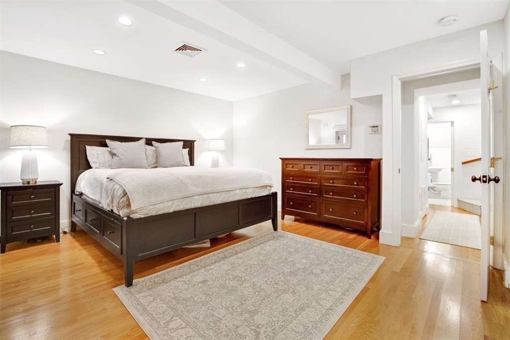 5 Bond Street, Unit 1 Boston, MA 02118 - Photo 12 of 18 a living room with a bed and furniture