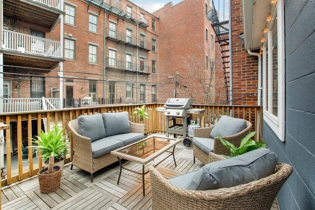 5 Bond Street, Unit 1 Boston, MA 02118 - Photo 9 of 18 a balcony with outdoor seating