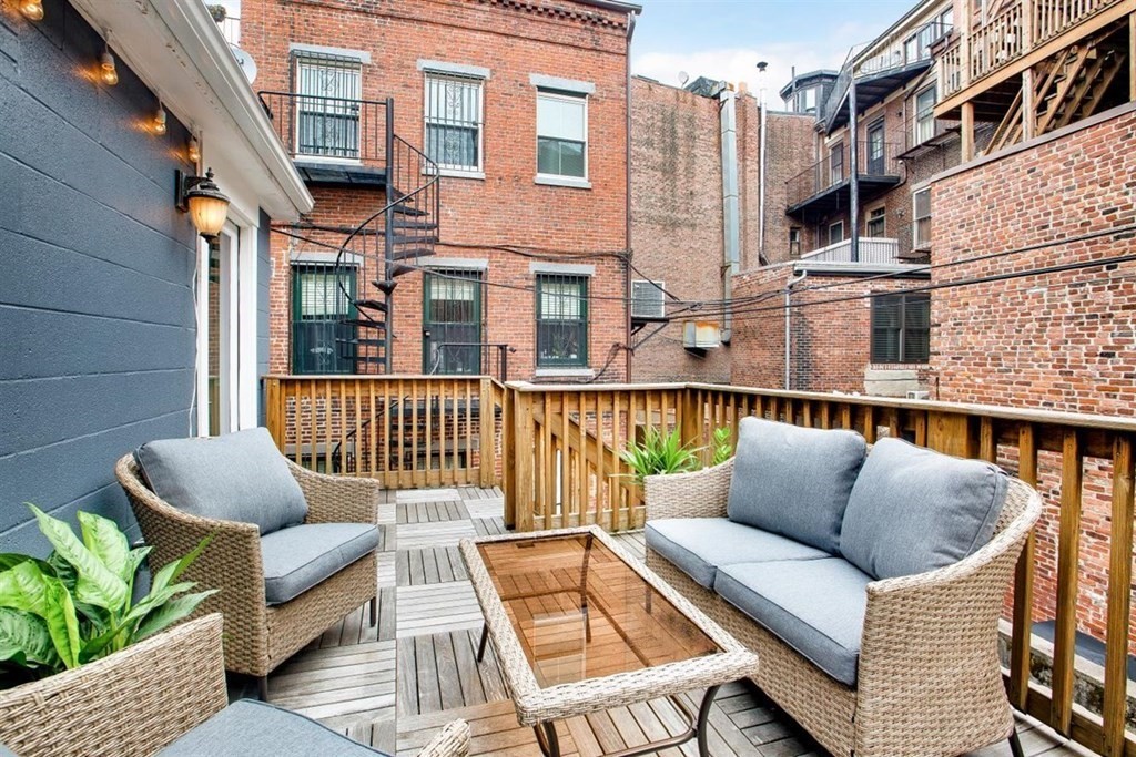 5 Bond Street, Unit 1 Boston, MA 02118 - Photo 10 of 18 a balcony with furniture and a potted plant