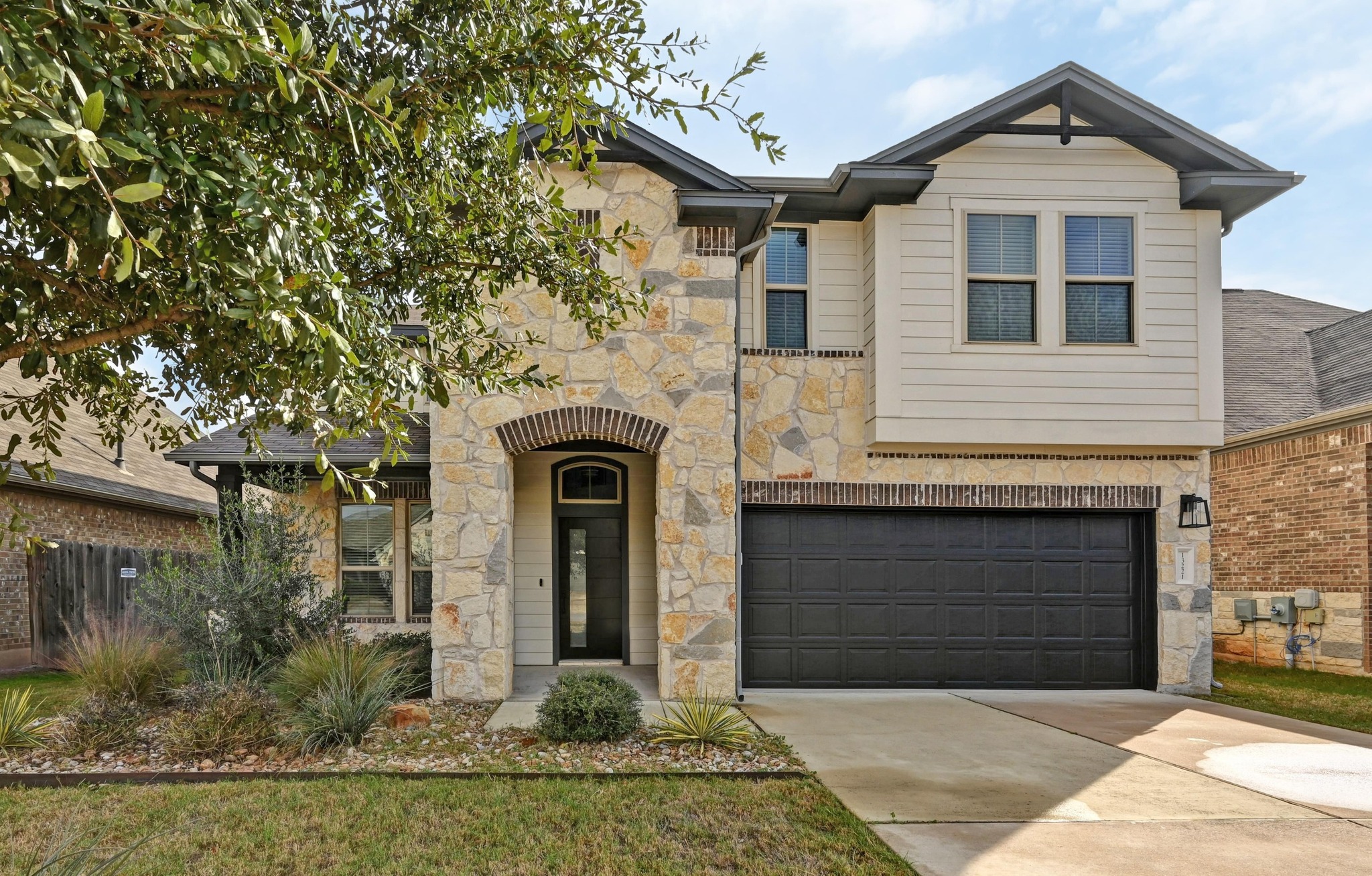 a front view of a house with garden