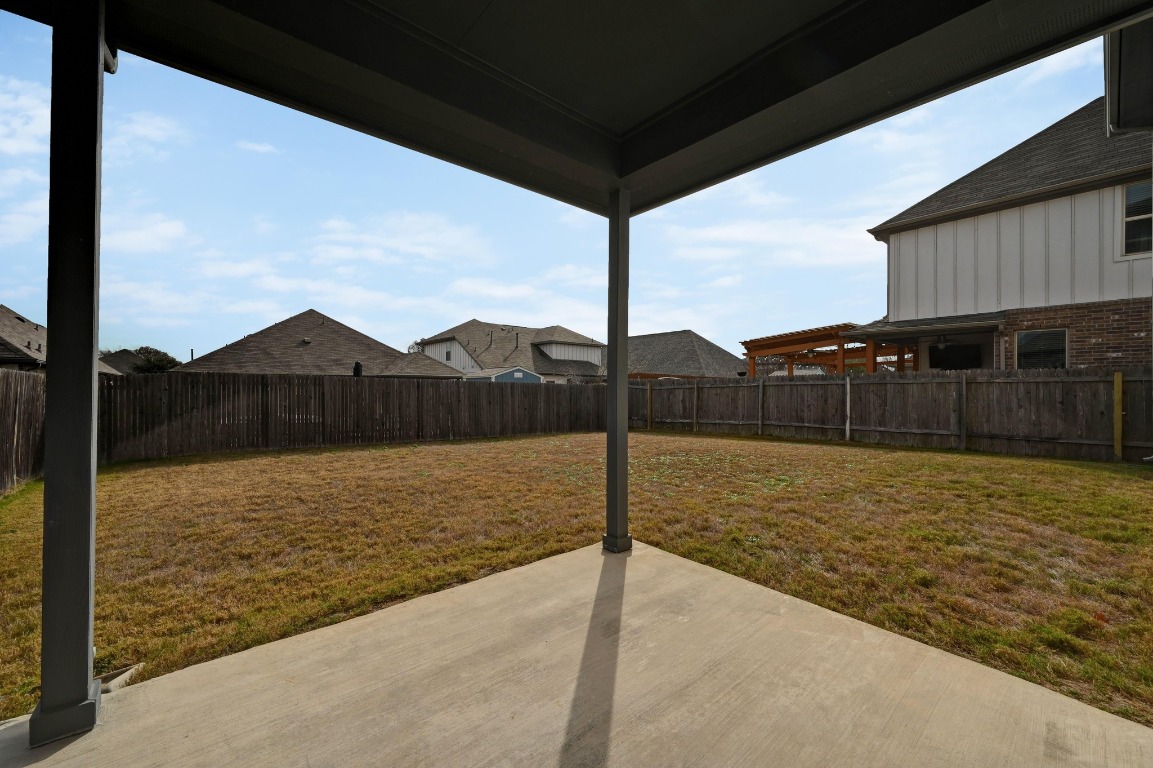 13221 Mariscan Street Manchaca, TX 78652 - Photo 29 of 36 Fenced backyard with a patio