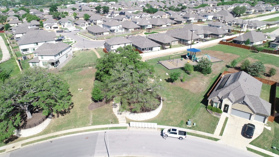 13221 Mariscan Street Manchaca, TX 78652 - Photo 33 of 36 Aerial view of property and surrounding area featuring nearby suburban area